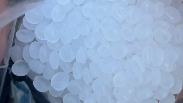 LDPE off-grade pellets in an open plastic bag — close-up